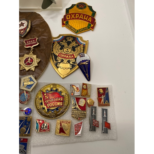 106 - Large quantity of military themed badges - Soviet space program, political pins, military guards uni... 