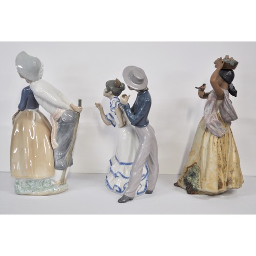 8 - Lladro porcelain of gres finish depicting  bird on hand model no.12151 together with two other Nao f... 