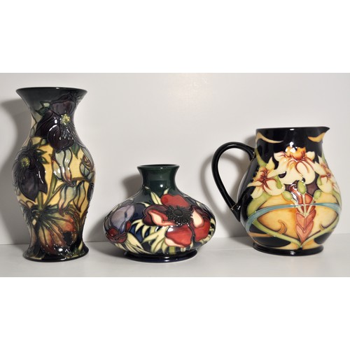 16 - Group of Moorcroft vases and jugs in a floral design, x3 in total. AF