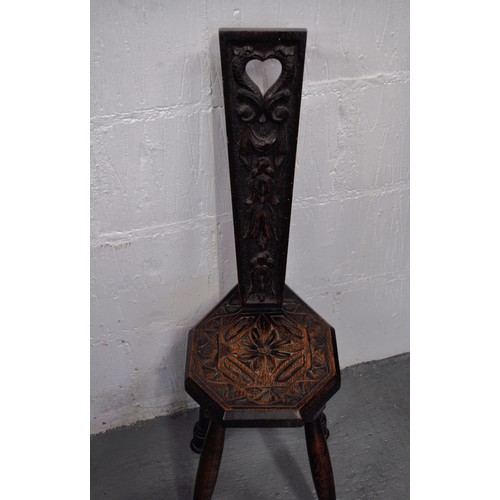 79 - Antique spinning chair with hand-carved design to back panel, approx H86cm