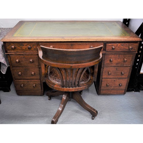 80 - Vintage oak campaign desk on casters together with an oak chair with a tilt swivel on brass casters ... 