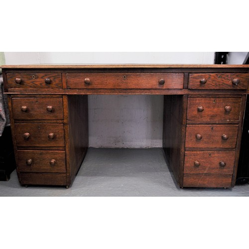 80 - Vintage oak campaign desk on casters together with an oak chair with a tilt swivel on brass casters ... 