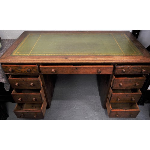 80 - Vintage oak campaign desk on casters together with an oak chair with a tilt swivel on brass casters ... 