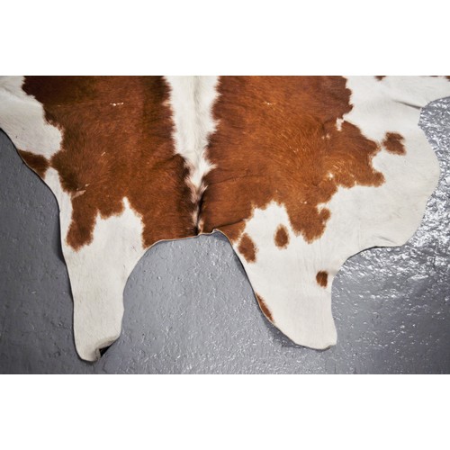 89 - Large Cow Hide rug purchased in Argentina approx. 92inch long, 76inch wide