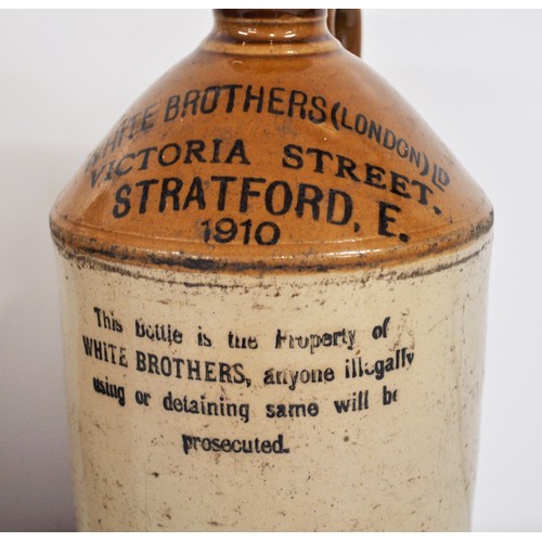 33 - x2 flagons marked White Brothers (London)Victoria Street Stratford 1910 and Corwley & Co, 657 Commer... 