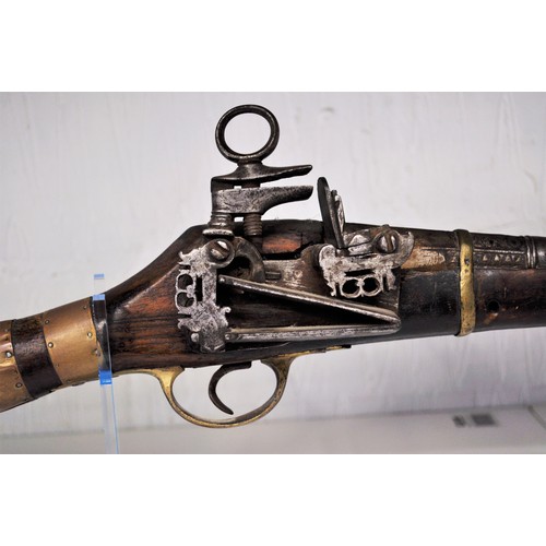 134 - Antique flintlock musket, walnut stock, with white/brass  metal decoration and brass banding, possib... 