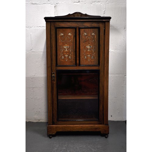 102 - Edwardian inlaid rosewood castored cupboard/music cabinet with marquetry decoration, lower half glaz... 