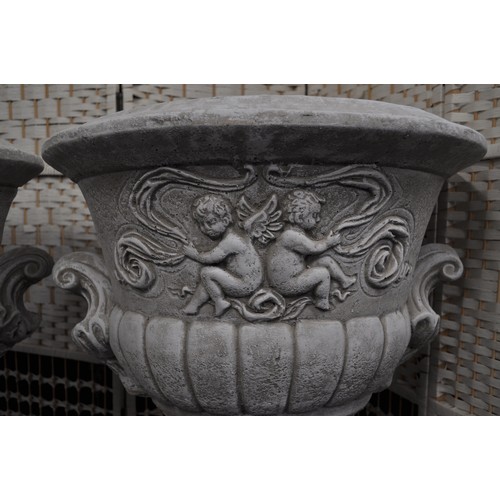 120 - Pair of reconstituted stone garden urns, (comes in two parts) approx height 67cm