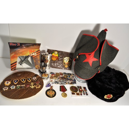 131 - A large group of Russian Soviet related items to include hats,  hip flask, keychain with collapsible... 