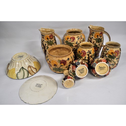 14 - A large quantity of Woods Indian Tree and Burslem ware in a majolica style consisting vases, jugs, e... 