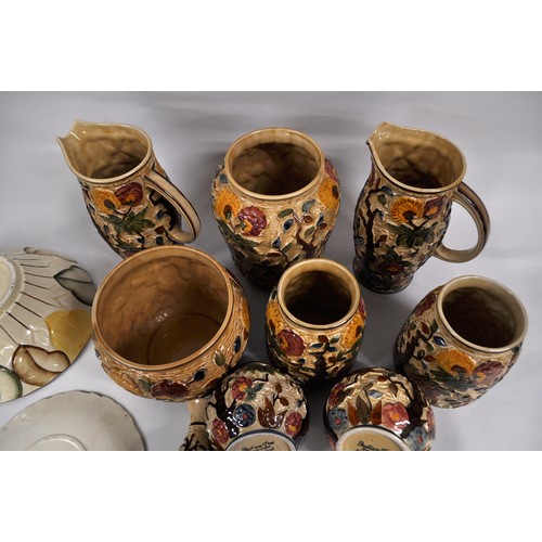 14 - A large quantity of Woods Indian Tree and Burslem ware in a majolica style consisting vases, jugs, e... 