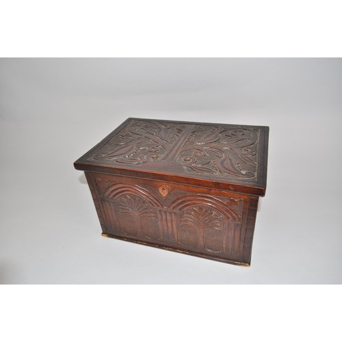 97 - Victorian arts & crafts wooden sewing box with ornately carved  tree/foliate design to facades with ... 