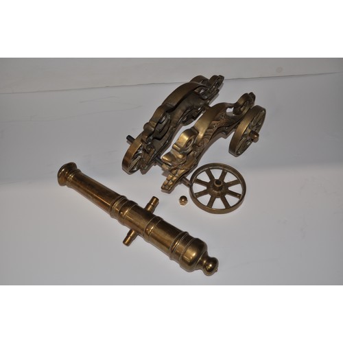 39 - Brass horse drawn brass model gypsy/romany caravan together with brass cannon AF