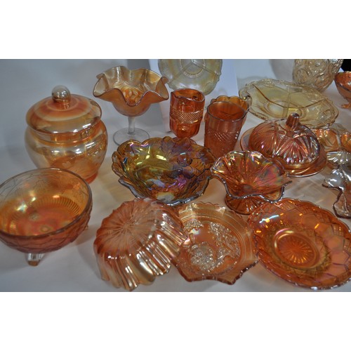 18 - A large quantity of decorative Carnival Glass and other items consisting of various bowls, jugs, vas... 