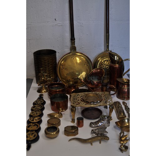 42 - A Mixed collection of copper and brassware items to include; jugs, bowls, watering can, mini coal sc... 