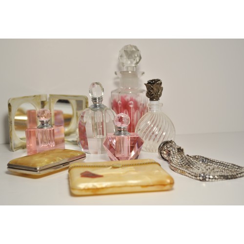 24A - A group of dressing table items to include glass perfume bottles, Stratton compact and lipstick hold... 