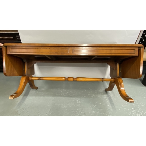 117 - Bevan Funnell Lounge table with green leather inserts, drop leaf to both ends