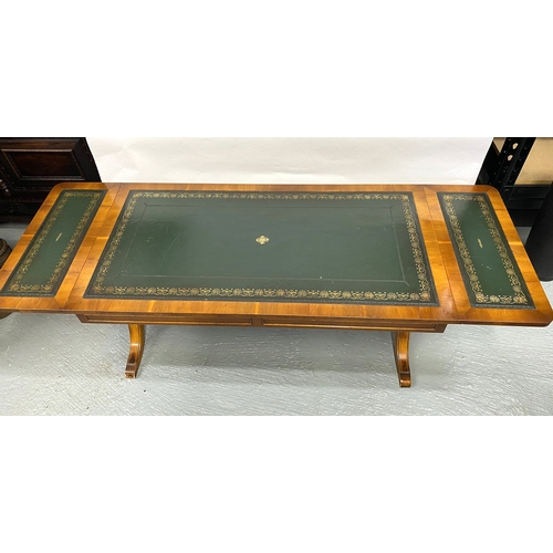 117 - Bevan Funnell Lounge table with green leather inserts, drop leaf to both ends