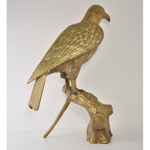 56 - A brass bird of prey perched/resting on a branch