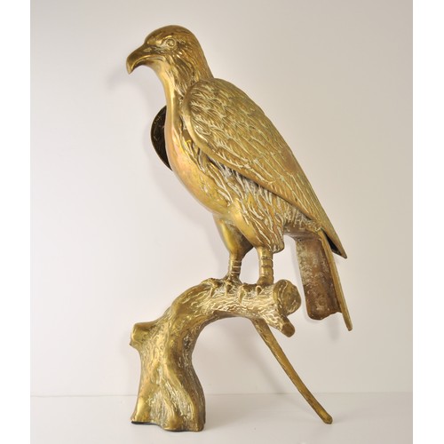 56 - A brass bird of prey perched/resting on a branch