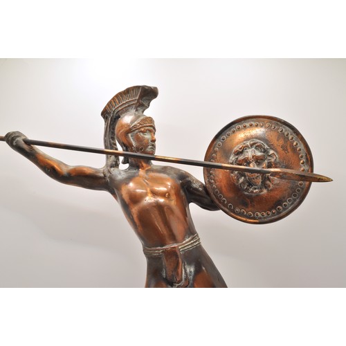 58 - Bronzed antique figure of Roman Centurion/warrior with spear and shield, on marble plinth, approx. h... 