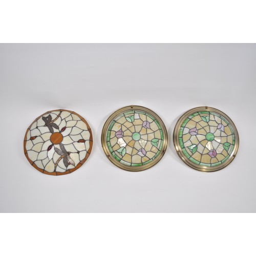 62 - A pair of Tiffany / Mackintosh style ceiling glass light shades together with one other glass upligh... 