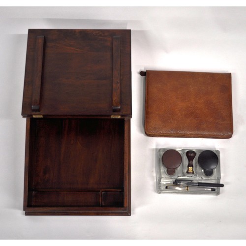 83 - Mahogany writing slope which includes contents consisting of  glass inkwells, pens, leather case