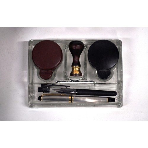 83 - Mahogany writing slope which includes contents consisting of  glass inkwells, pens, leather case