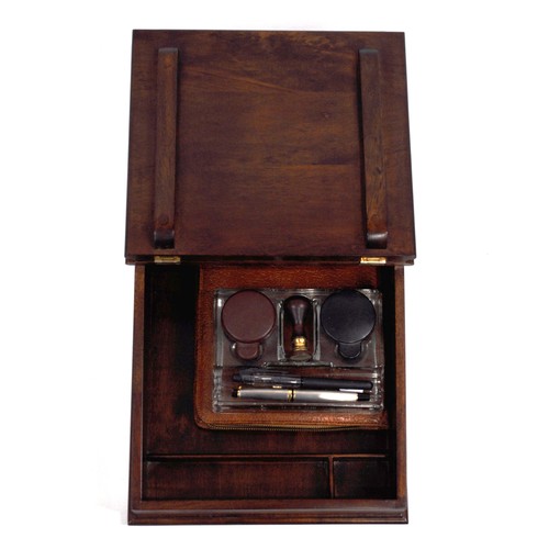 83 - Mahogany writing slope which includes contents consisting of  glass inkwells, pens, leather case