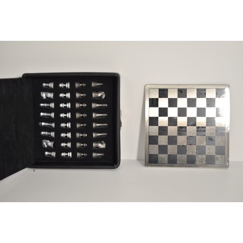 91 - Dulwich Designs magnetic mini chess set together with two boxed timepieces in the form of chess piec... 