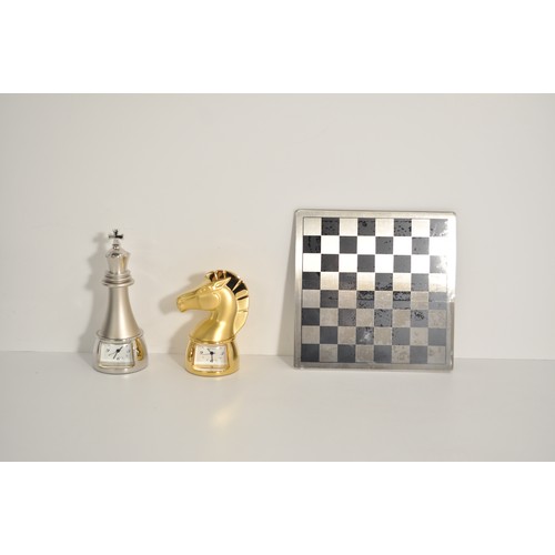 91 - Dulwich Designs magnetic mini chess set together with two boxed timepieces in the form of chess piec... 