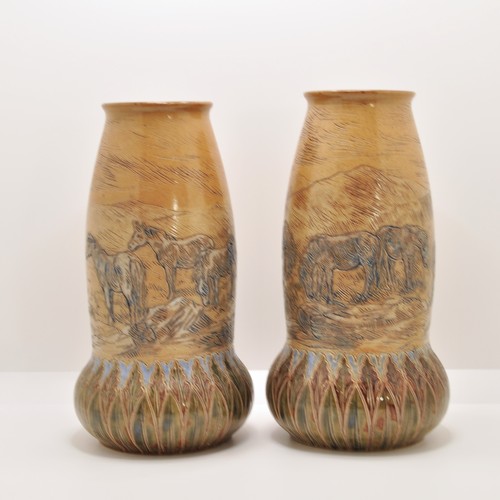 94 - A pair of antique Doulton Lambeth rare form vases, with incised design of grazing wild horses, by Ha...