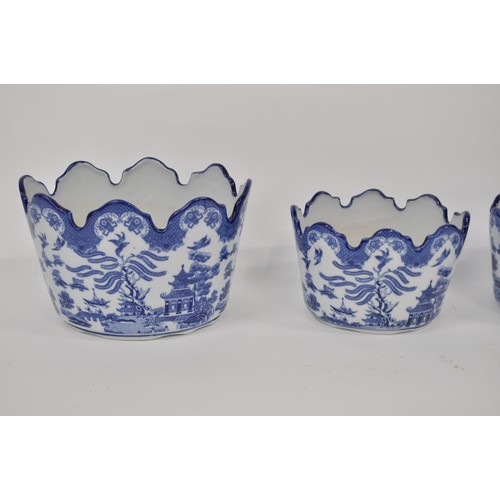 106 - Blue and white ceramic oval planters, Willow pattern style designs depicting pagoda landscape scenes... 