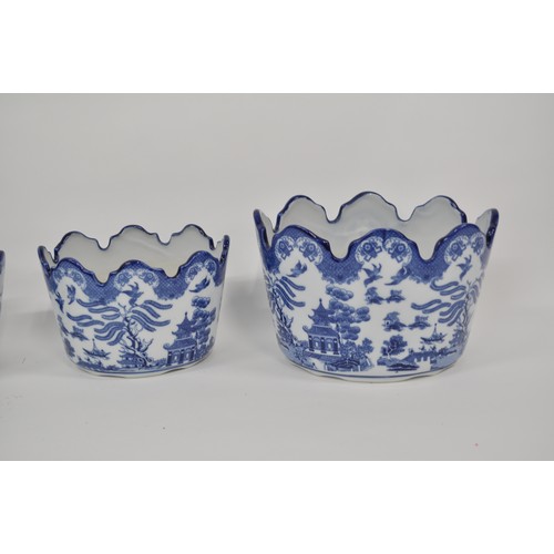 106 - Blue and white ceramic oval planters, Willow pattern style designs depicting pagoda landscape scenes... 