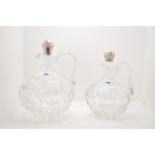 129 - Two crystal C B Z Holland  decanters, both with stoppers and one hallmarked 925 makers mark DJ