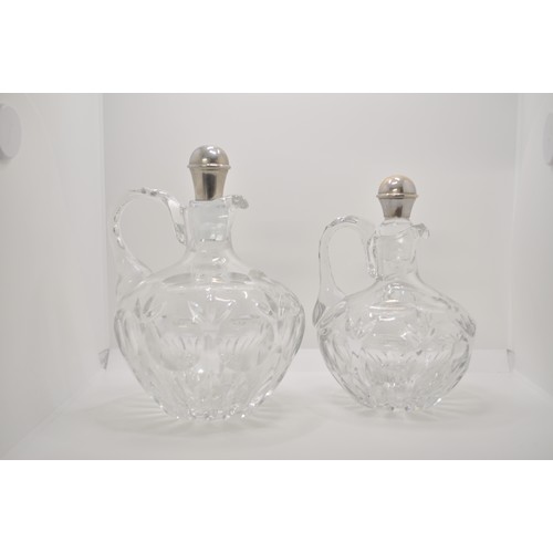 129 - Two crystal C B Z Holland  decanters, both with stoppers and one hallmarked 925 makers mark DJ