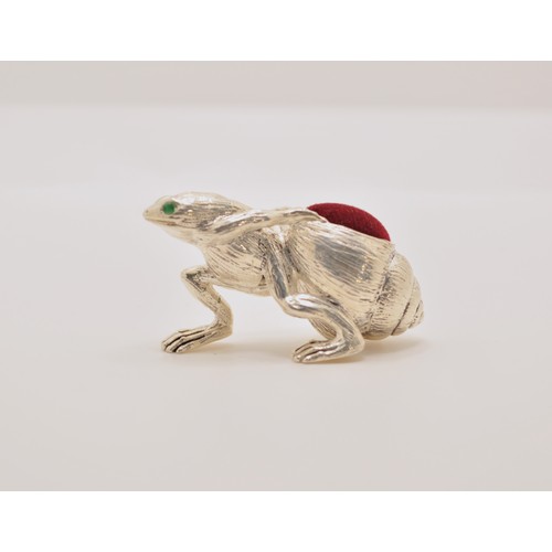 144 - A quirky pincushion in the frog carrying snail, stamped 925 silver plate to base