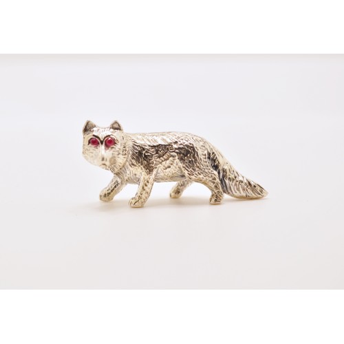 145 - A silver fox figure with ruby eyes, stamped Sterling