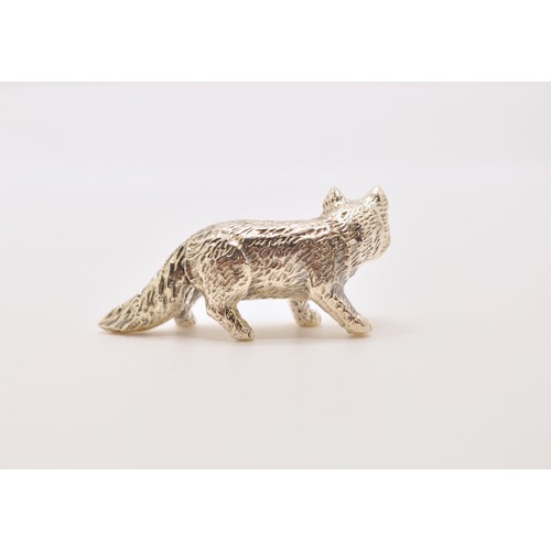 145 - A silver fox figure with ruby eyes, stamped Sterling