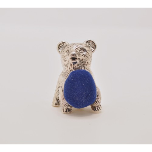 147 - A silver bear pincushion in seated stance