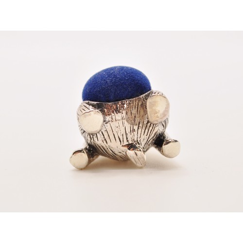 147 - A silver bear pincushion in seated stance