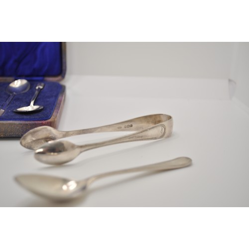 155 - Cased spoons with finials, hallmarked Birmingham 1932, together with sugar tongs and one other spoon... 