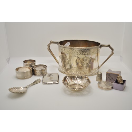 162 - Silver and Silver plate items consisting engraved twin handled decorative pot, napkin rings, match c... 