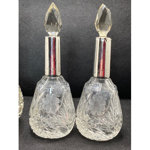 168E - Antique perfume bottles consisting pair of faceted tops with silver collars hallmarked Birmingham,  ... 