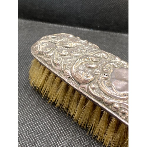 168F - Antique repousse silver backed clothes brush hallmarked Chester 1901 together with rectangular trink... 