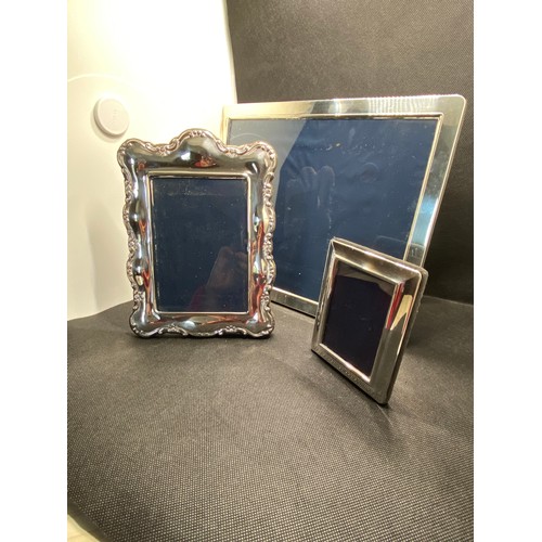 168G - x3 Silver mounted photoframes,  hallmarked Sheffield  1990 and 2002. Largest size frame measures L28... 