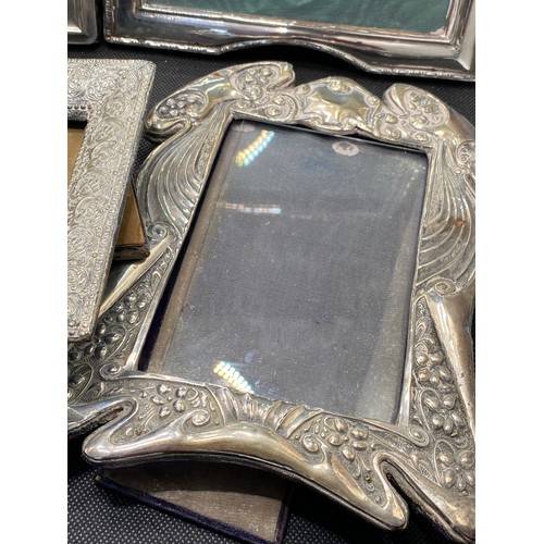 168H - A group of Silver mounted photo frames various designs and size, All marked Silver, predominately ha... 