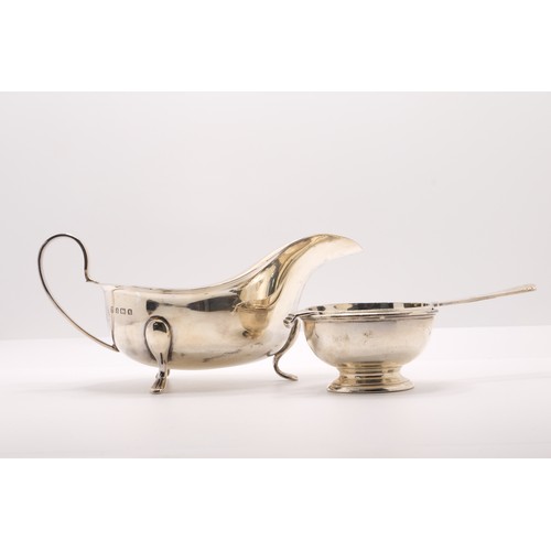 220 - Solid silver two piece tea strainer and holder hallmarked London by EBS and silver gravy boat, hallm... 