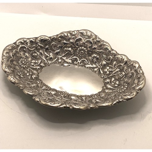 221 - Silver oval embossed bon bon dish with decorative flower and scroll detailing, hallmarked London 189... 