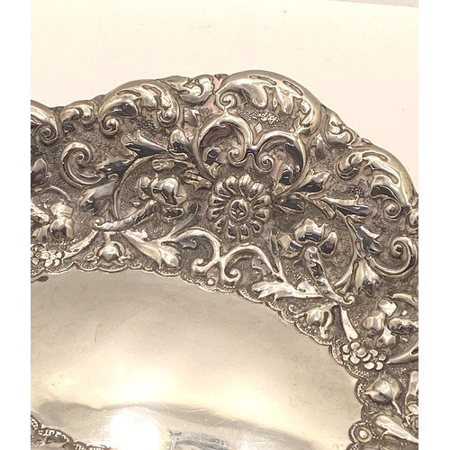 221 - Silver oval embossed bon bon dish with decorative flower and scroll detailing, hallmarked London 189... 